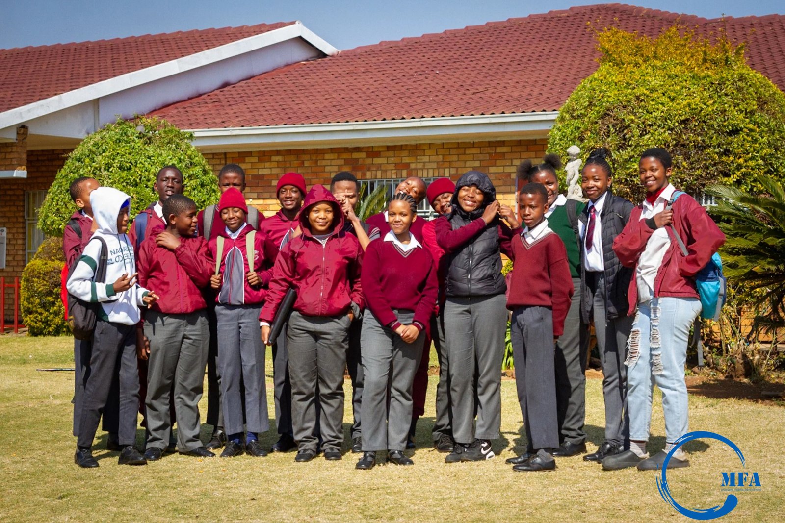 Group of students outdoors in school uniform